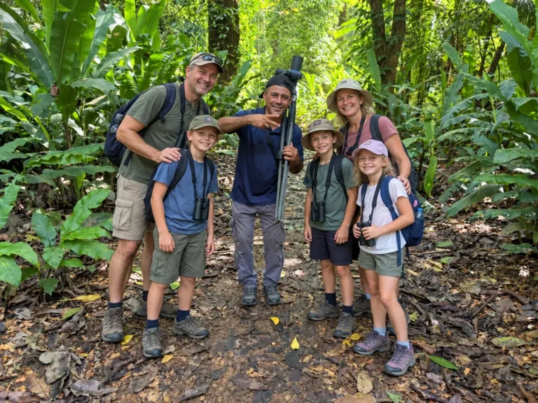 Guide and guests walking a maintained trail in Carara National Park
